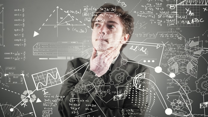 man drawing mathematical formula