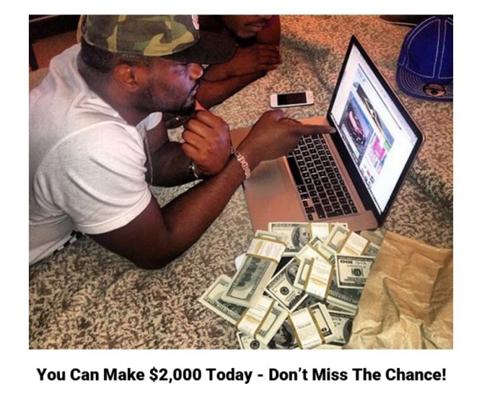 man looking at laptop