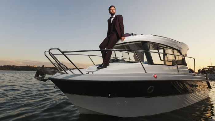successful man on a yacht